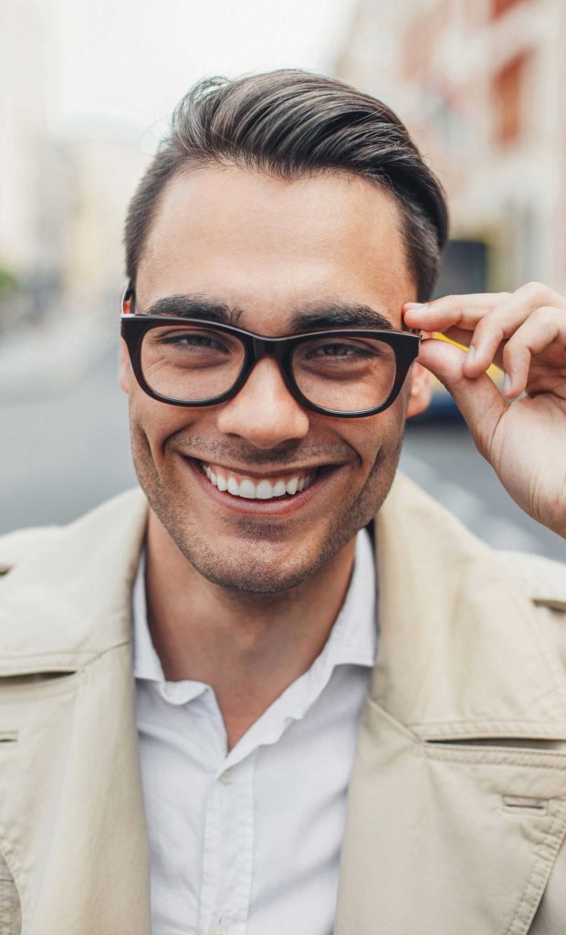 Man with glasses smiling